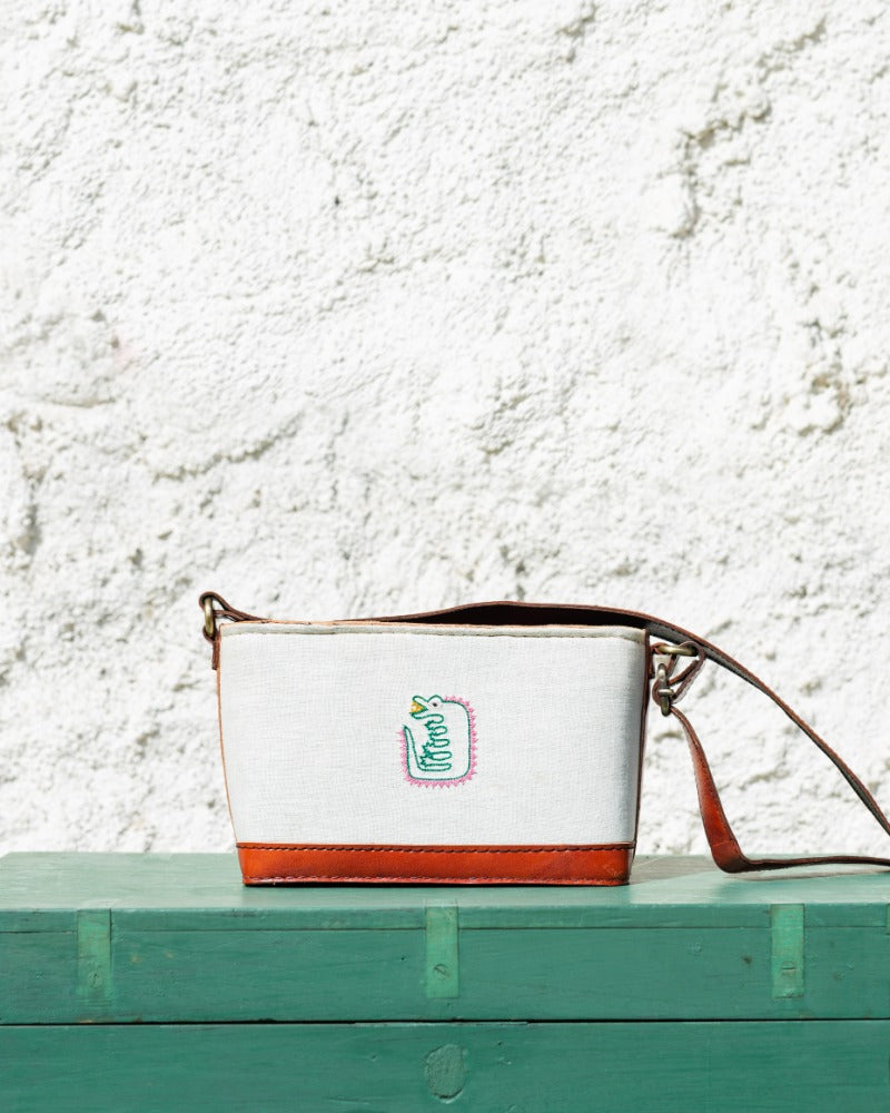 Crocodile embroidered leather sling bag