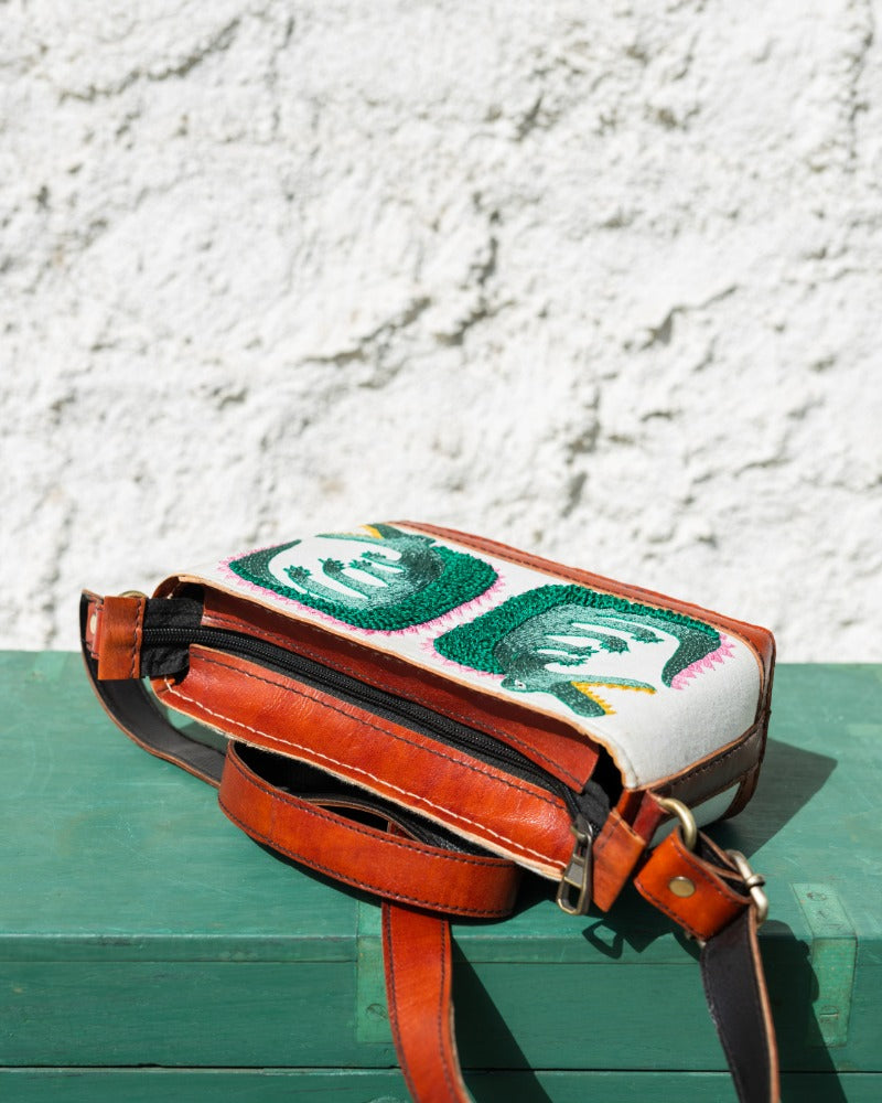 Crocodile embroidered leather sling bag