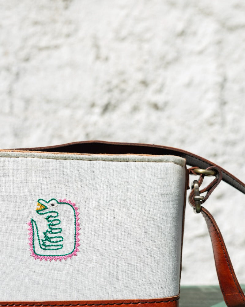 Crocodile embroidered leather sling bag