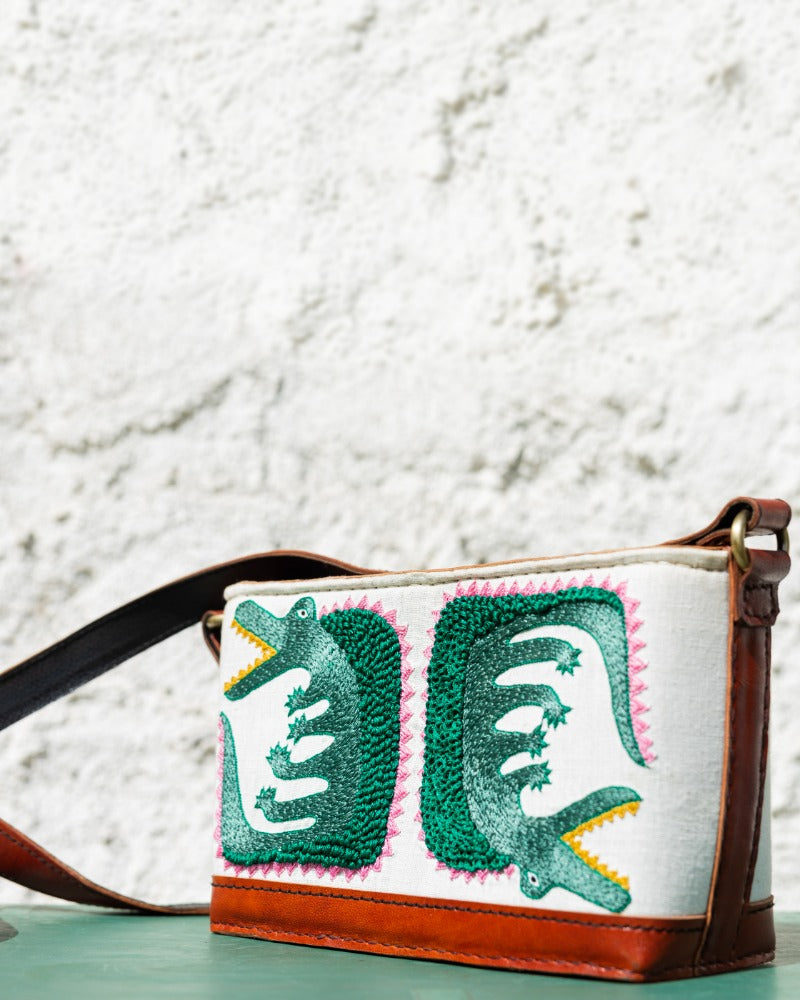 Crocodile embroidered leather sling bag